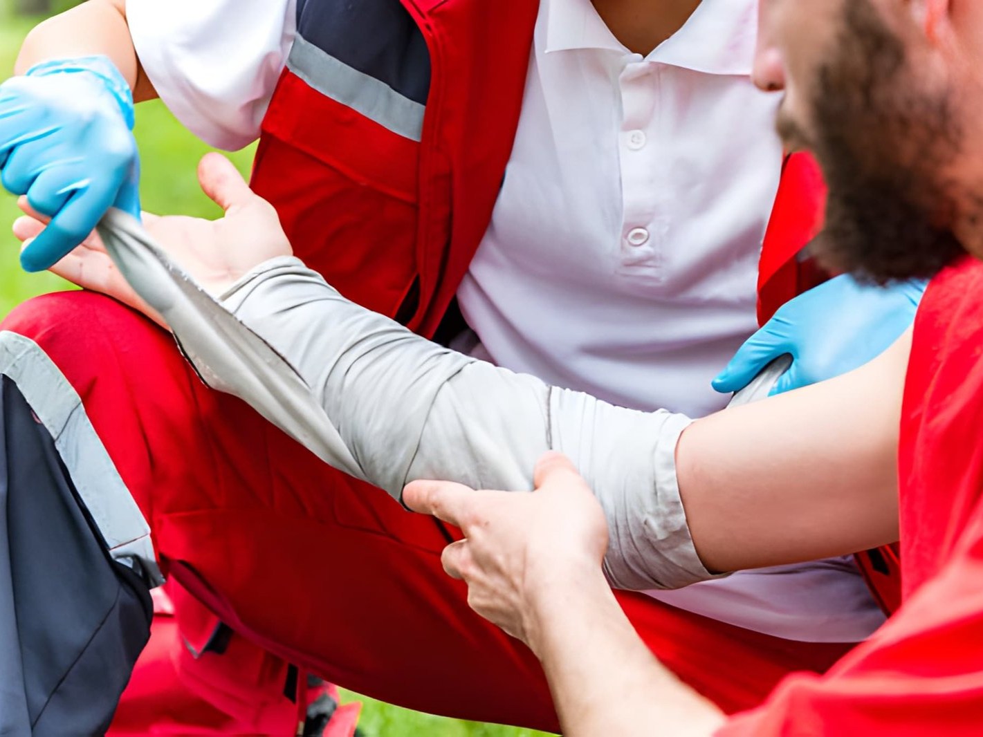A person is being assisted by a medical professional, likely