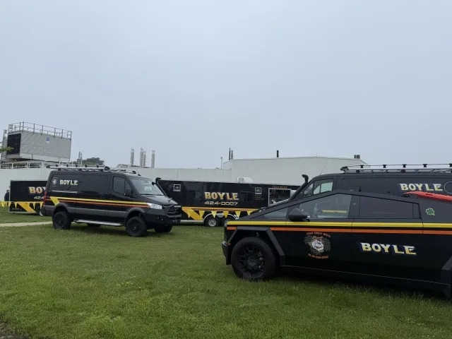 Boyle Contracting vehicles are parked on a grassy field
