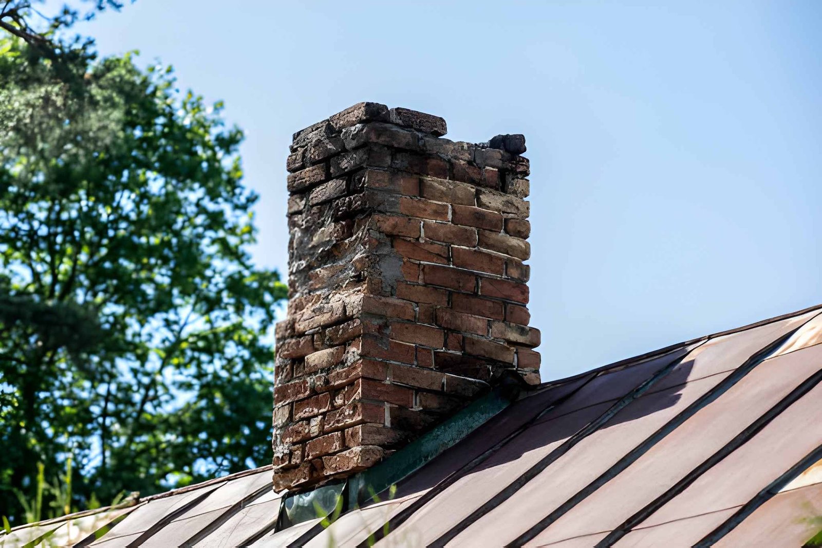 Old brick chimney in need of repair